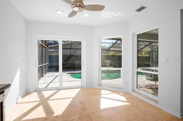 interior space featuring ceiling fan