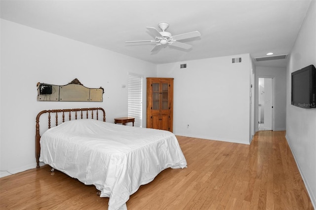 bedroom with hardwood / wood-style floors and ceiling fan