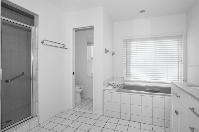 full bathroom with tile patterned floors, vanity, toilet, and separate shower and tub