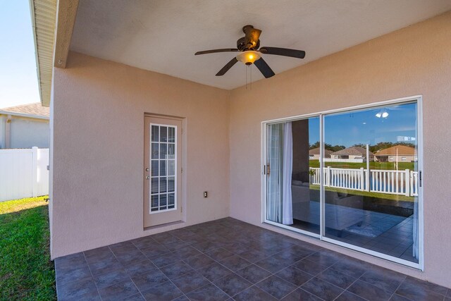 view of patio featuring ceiling fan