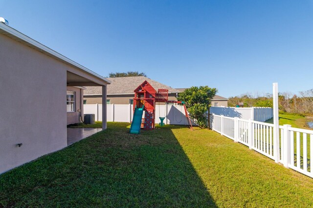 view of yard with a playground and cooling unit