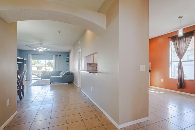 corridor featuring light tile patterned floors