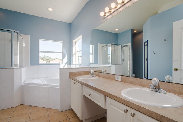 bathroom featuring tile patterned floors, vanity, and independent shower and bath