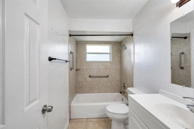 full bathroom with tile patterned floors, vanity, a textured ceiling, tiled shower / bath combo, and toilet