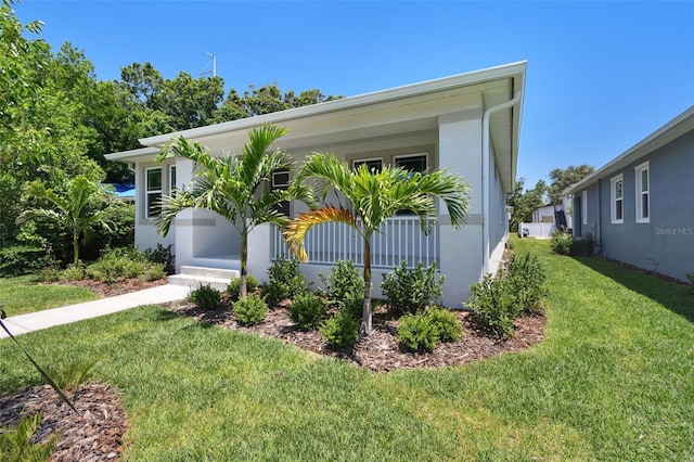 2735 36th Ave N, Saint Petersburg, FL 33713 - view of front of home featuring a front lawn and stucco siding