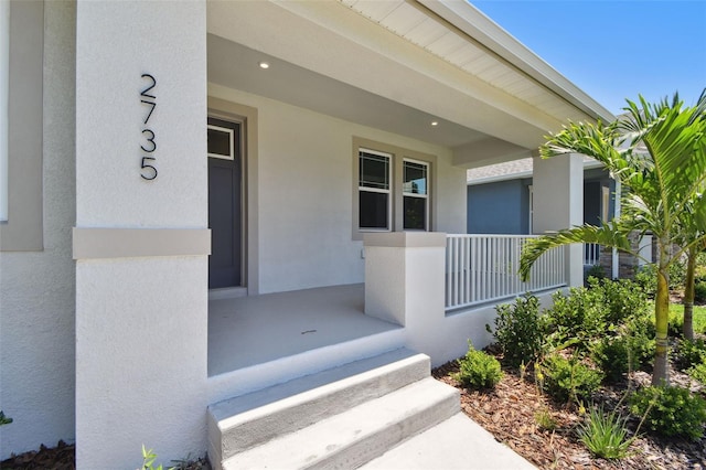 2735 36th Ave N, Saint Petersburg, FL 33713 - entrance to property with stucco siding and covered porch