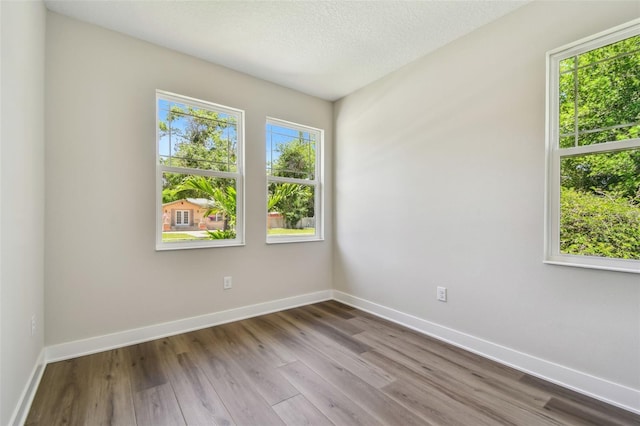 2735 36th Ave N, Saint Petersburg, FL 33713 - unfurnished room with baseboards and wood finished floors
