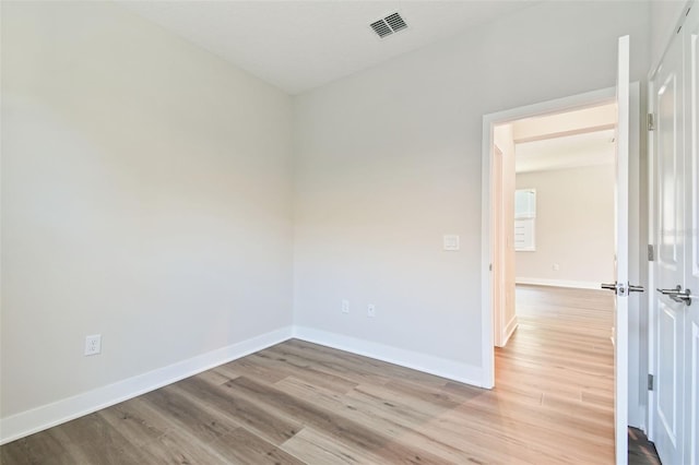 2735 36th Ave N, Saint Petersburg, FL 33713 - empty room with light wood finished floors and baseboards