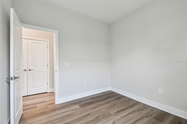2735 36th Ave N, Saint Petersburg, FL 33713 - spare room featuring wood finished floors and baseboards