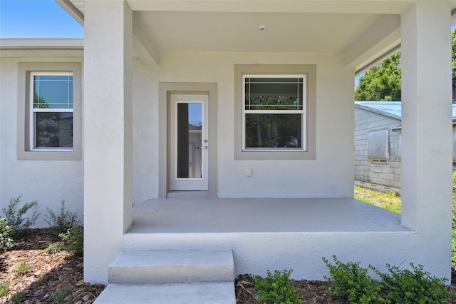 2735 36th Ave N, Saint Petersburg, FL 33713 - doorway to property featuring stucco siding