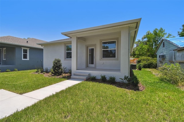 2735 36th Ave N, Saint Petersburg, FL 33713 - view of front of property featuring a front lawn and stucco siding