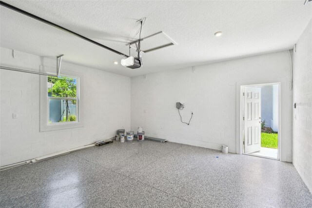 2735 36th Ave N, Saint Petersburg, FL 33713 - garage with concrete block wall and a garage door opener