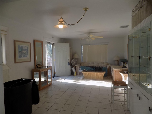 interior space featuring ceiling fan