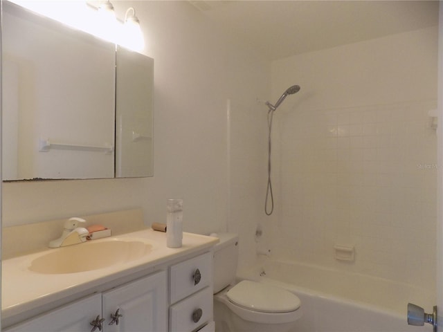 full bathroom featuring toilet, vanity, and tiled shower / bath