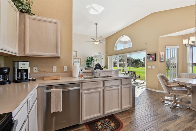 kitchen with dishwasher, lofted ceiling, ceiling fan with notable chandelier, sink, and hardwood / wood-style flooring