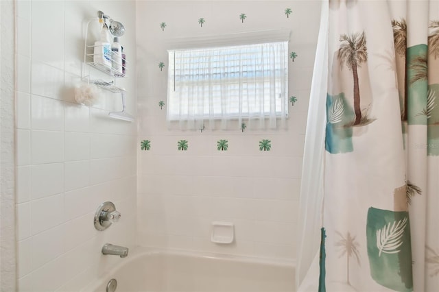 bathroom with shower / tub combo