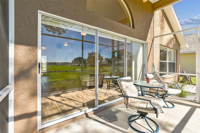 exterior space with beamed ceiling, high vaulted ceiling, and concrete floors