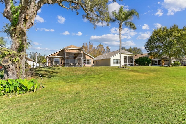 view of yard featuring a sunroom