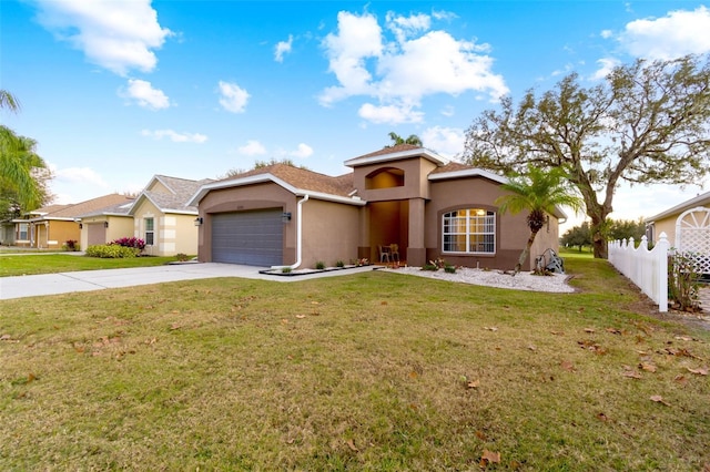 view of front of home with a garage and a front yard