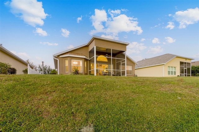 rear view of house with a lawn