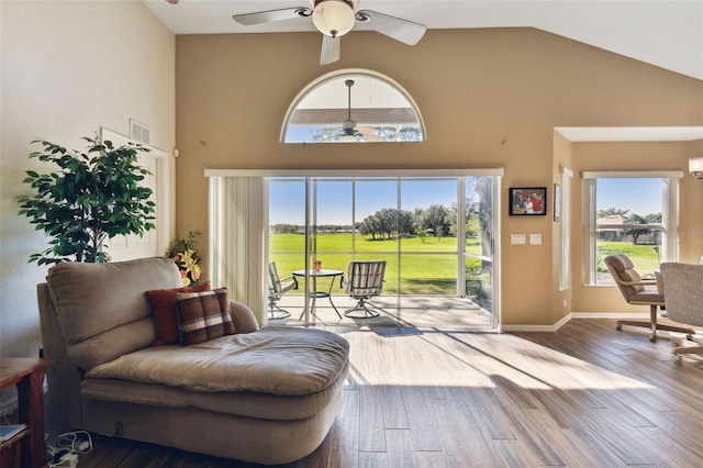 sitting room featuring a healthy amount of sunlight and hardwood / wood-style flooring