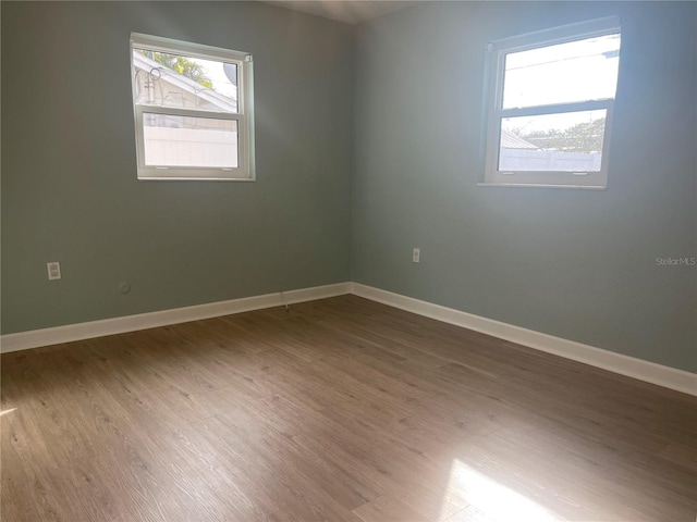 unfurnished room featuring hardwood / wood-style floors