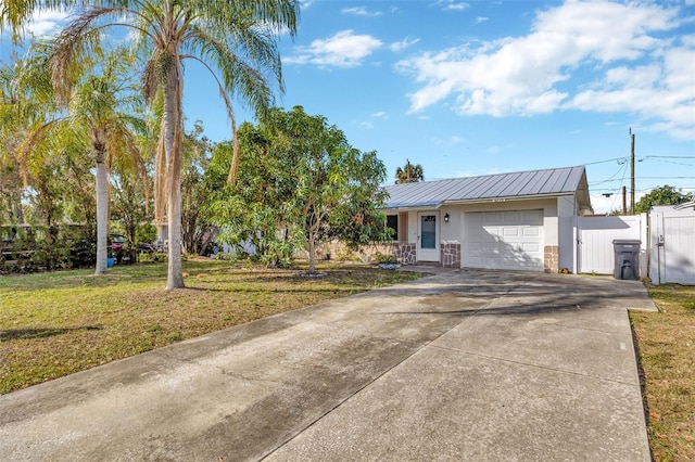 6598 26th St N, Saint Petersburg, FL 33702 - view of front facade with a porch, a garage, and a front yard