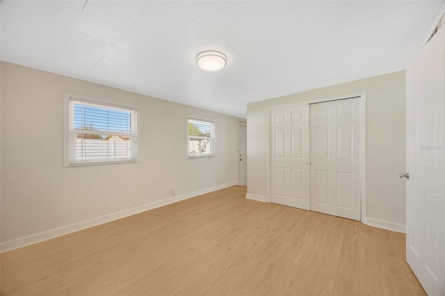 6598 26th St N, Saint Petersburg, FL 33702 - unfurnished bedroom with a closet and light hardwood / wood-style flooring