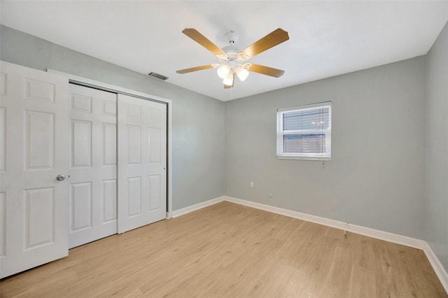 6598 26th St N, Saint Petersburg, FL 33702 - unfurnished bedroom featuring light hardwood / wood-style flooring, ceiling fan, and a closet