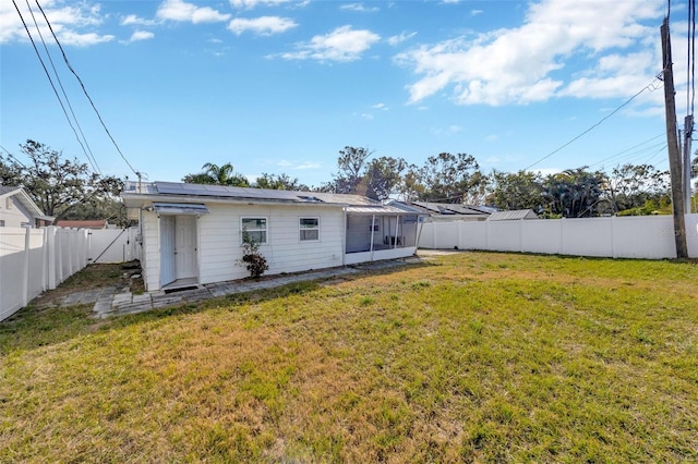 6598 26th St N, Saint Petersburg, FL 33702 - rear view of property featuring a yard