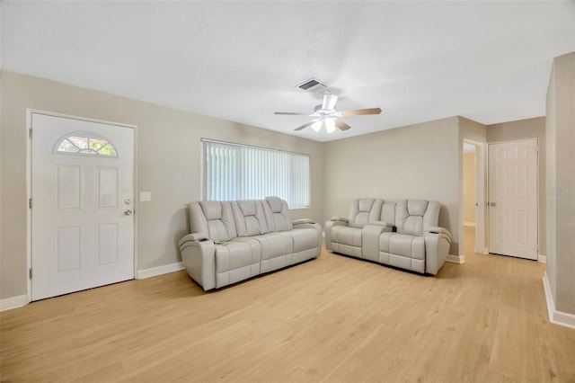 6598 26th St N, Saint Petersburg, FL 33702 - living room featuring ceiling fan and light wood-type flooring