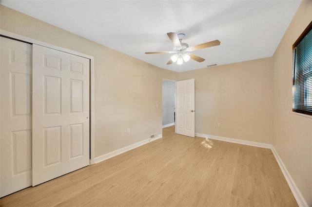 6598 26th St N, Saint Petersburg, FL 33702 - unfurnished bedroom with ceiling fan, a closet, and light wood-type flooring
