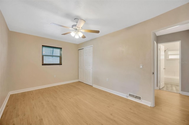6598 26th St N, Saint Petersburg, FL 33702 - unfurnished bedroom featuring light hardwood / wood-style floors, a closet, and ceiling fan