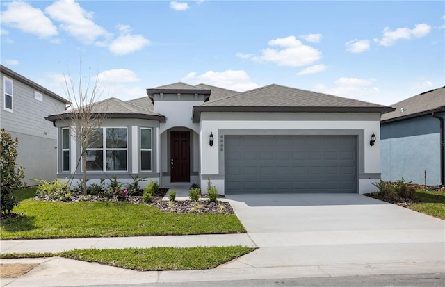 view of front of property with a garage, a shingled roof, driveway, stucco siding, and a front lawn