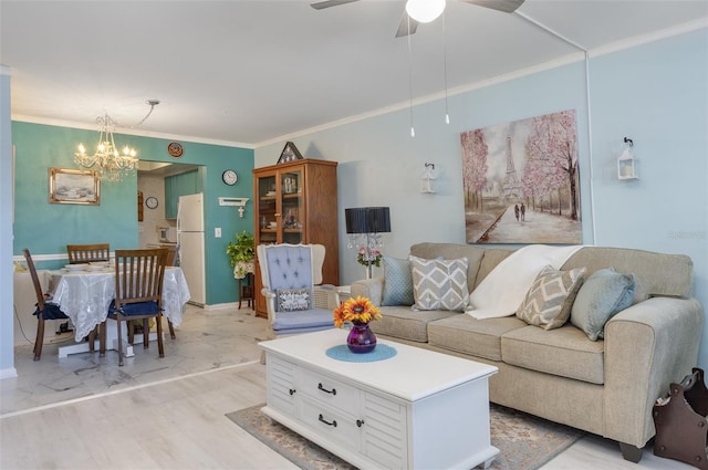 living room with crown molding and ceiling fan with notable chandelier