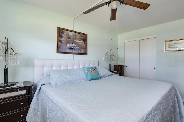 bedroom featuring ceiling fan and a closet