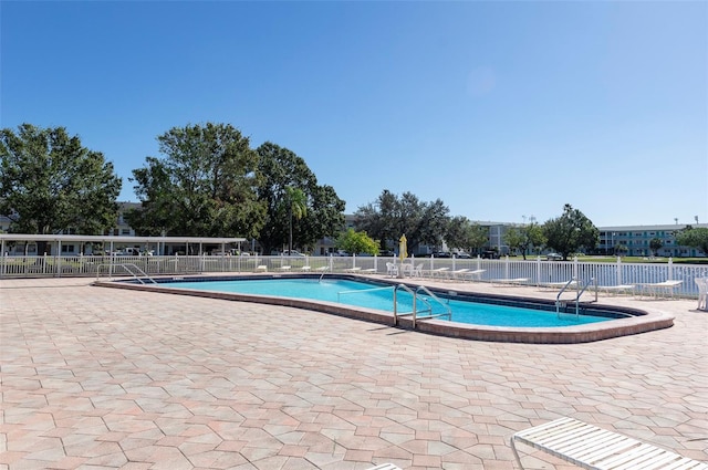 view of swimming pool with a patio