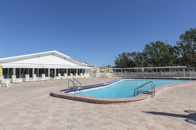 view of swimming pool featuring a patio area