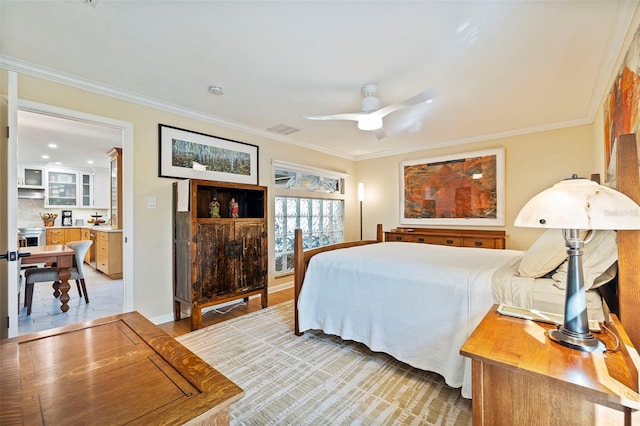 bedroom with ceiling fan and ornamental molding