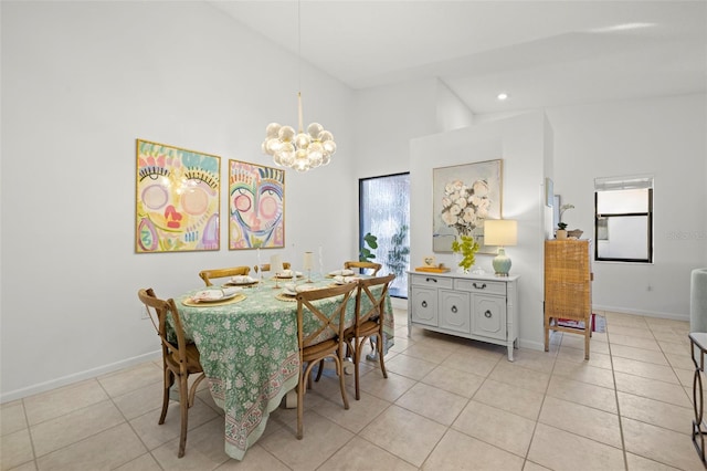 dining room with an inviting chandelier, high vaulted ceiling, a healthy amount of sunlight, and light tile patterned flooring