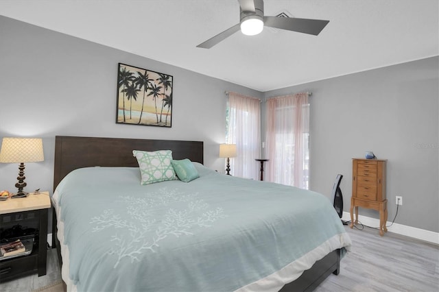 bedroom featuring ceiling fan and light hardwood / wood-style flooring