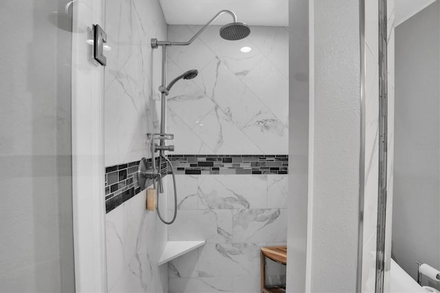 bathroom with a tile shower