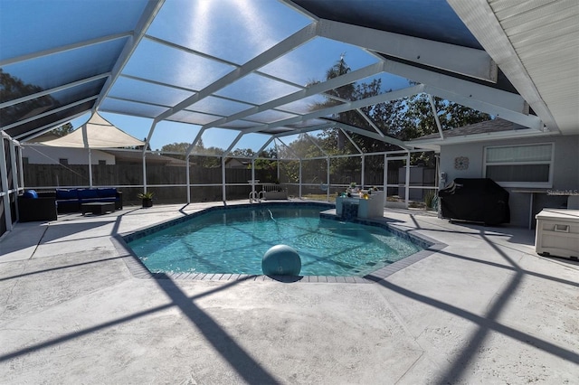 view of pool featuring glass enclosure, a grill, and a patio