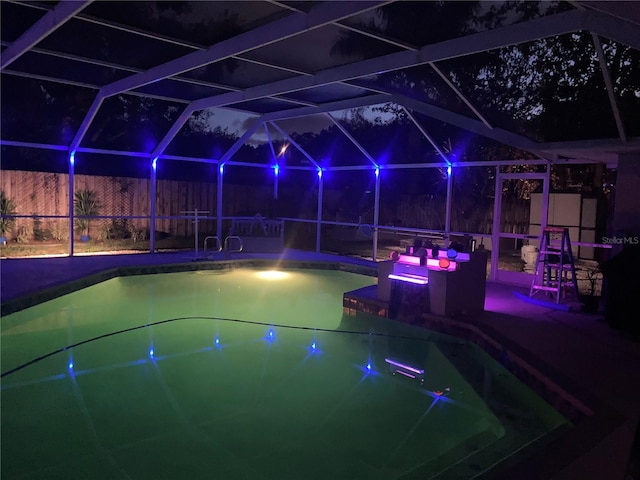 view of pool featuring a lanai