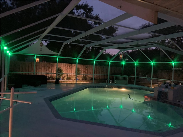 view of pool featuring a lanai and a patio