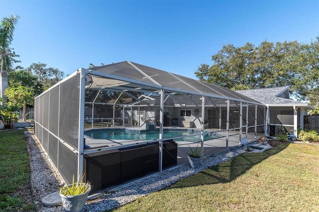 view of swimming pool featuring a yard and a lanai