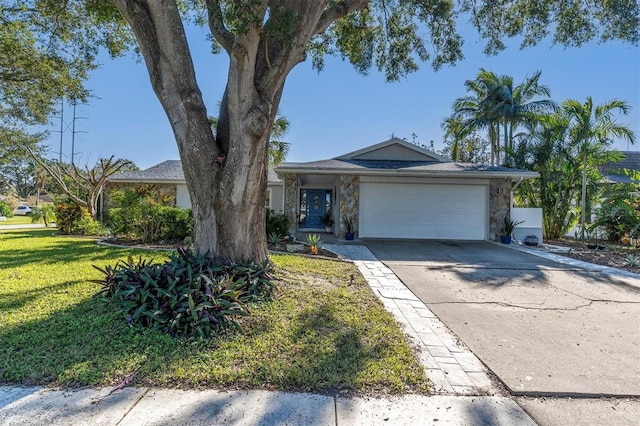 single story home with a front yard and a garage