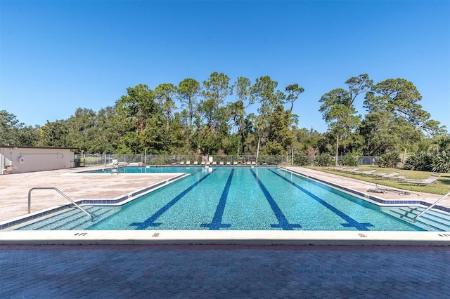 view of swimming pool featuring a patio