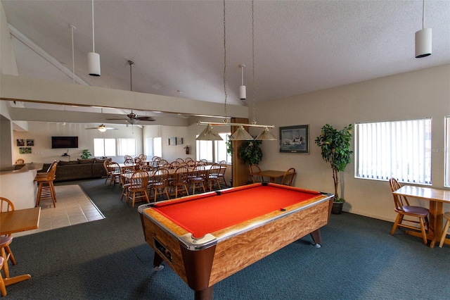 rec room with high vaulted ceiling, carpet flooring, ceiling fan, a textured ceiling, and pool table