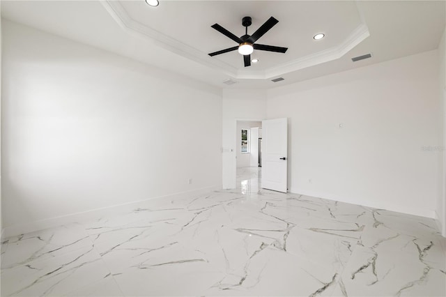 unfurnished room featuring crown molding, a tray ceiling, and ceiling fan